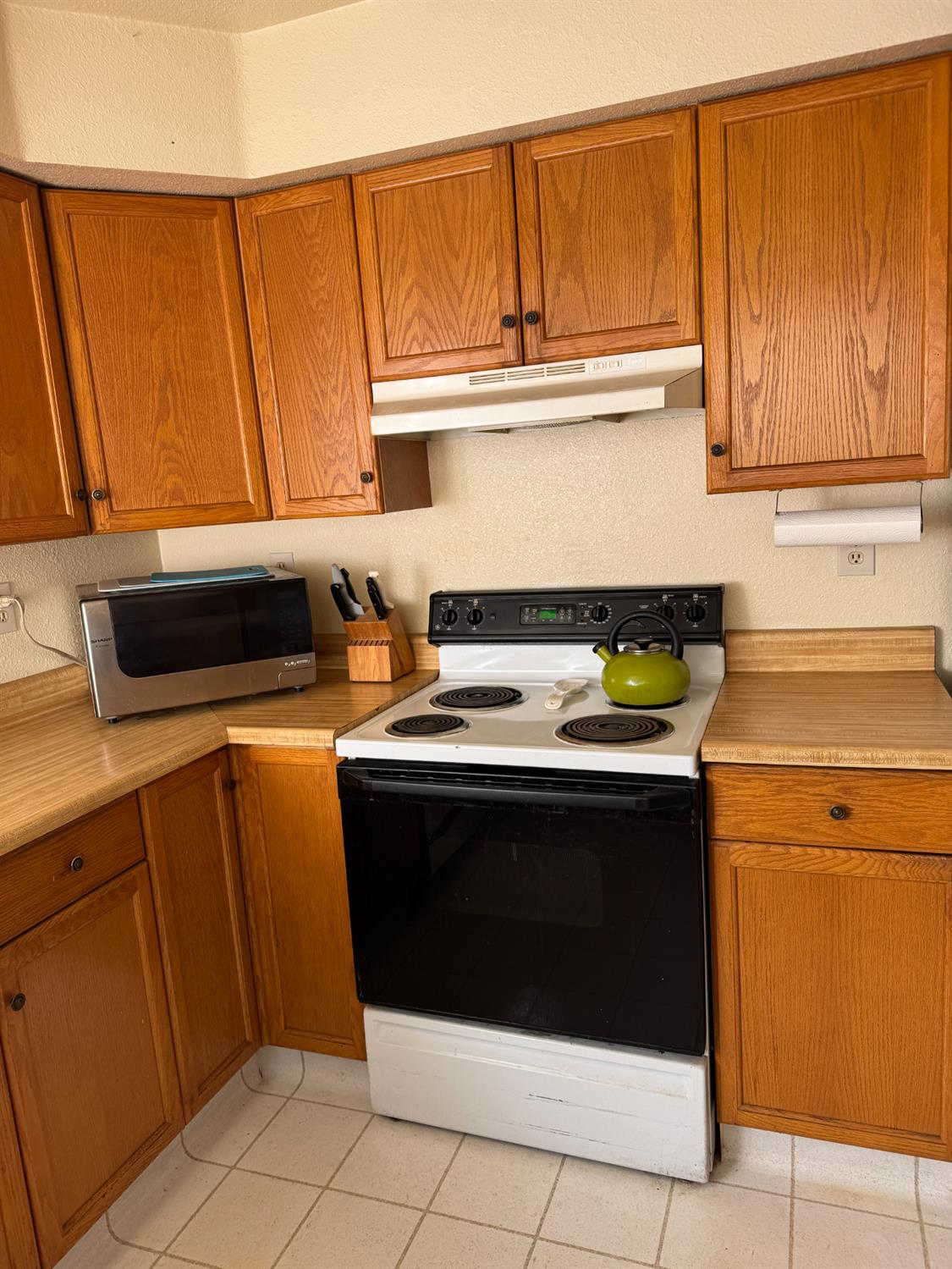 670 Stone House Road Auburn, CA 95603 - Photo 19 of 46 a stove top oven sitting inside of a kitchen