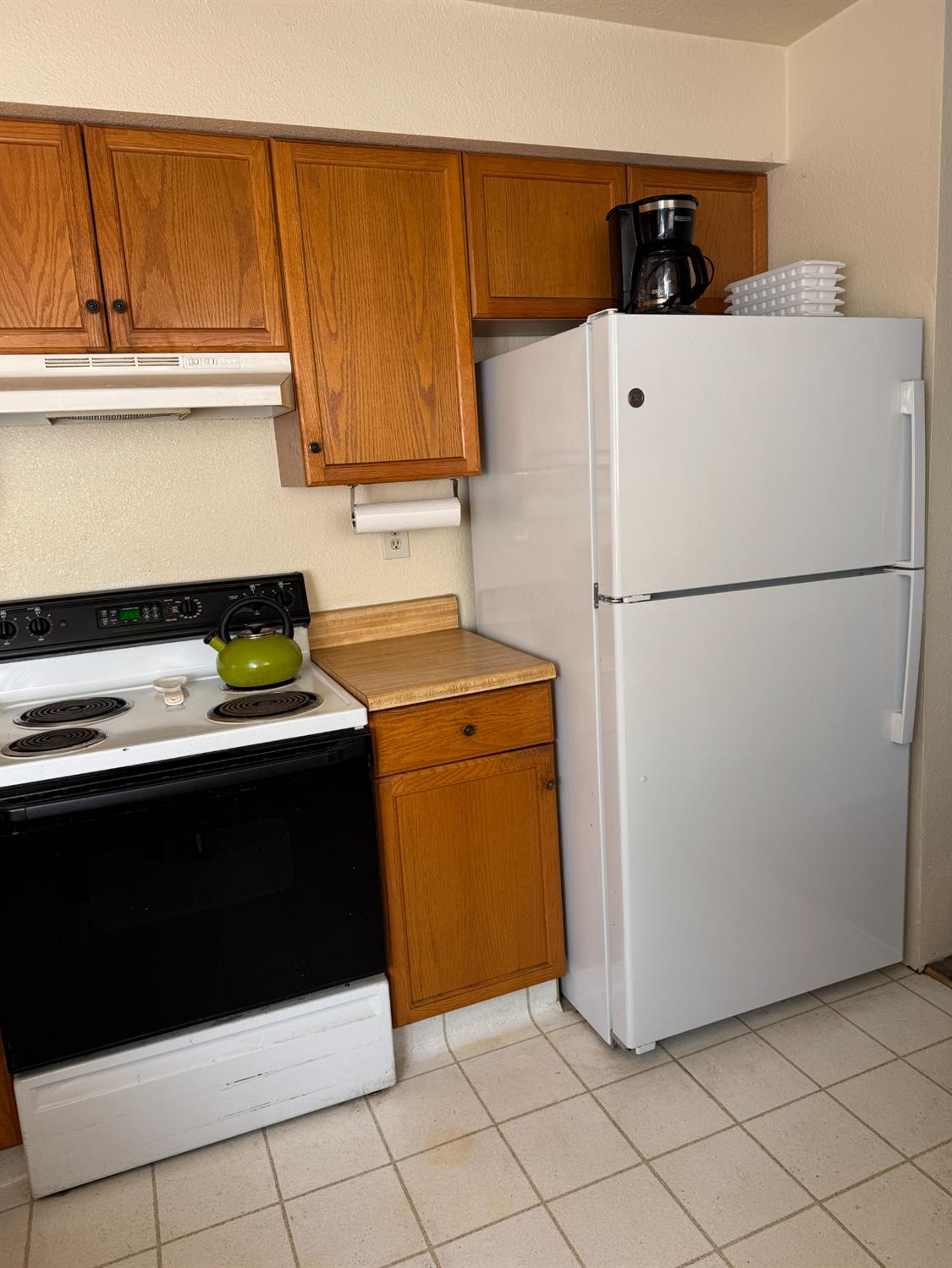 670 Stone House Road Auburn, CA 95603 - Photo 20 of 46 a white refrigerator freezer and a stove sitting inside of a kitchen