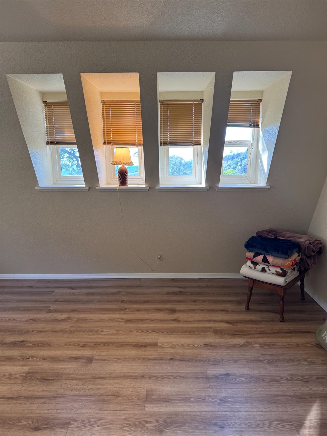 670 Stone House Road Auburn, CA 95603 - Photo 28 of 46 a view of an empty room with wooden floor and a window