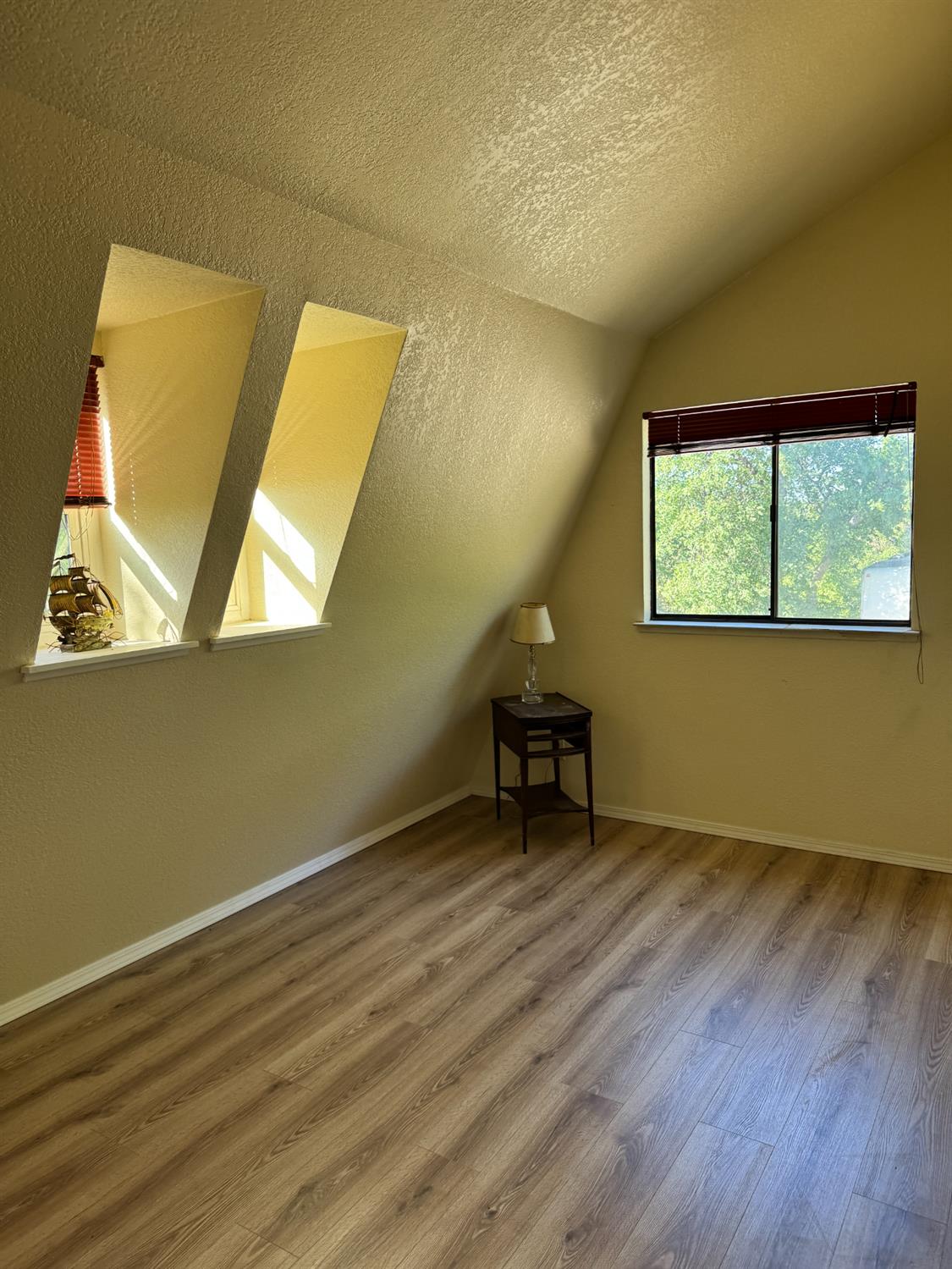 670 Stone House Road Auburn, CA 95603 - Photo 30 of 46 a view of a room with wooden floor and a window