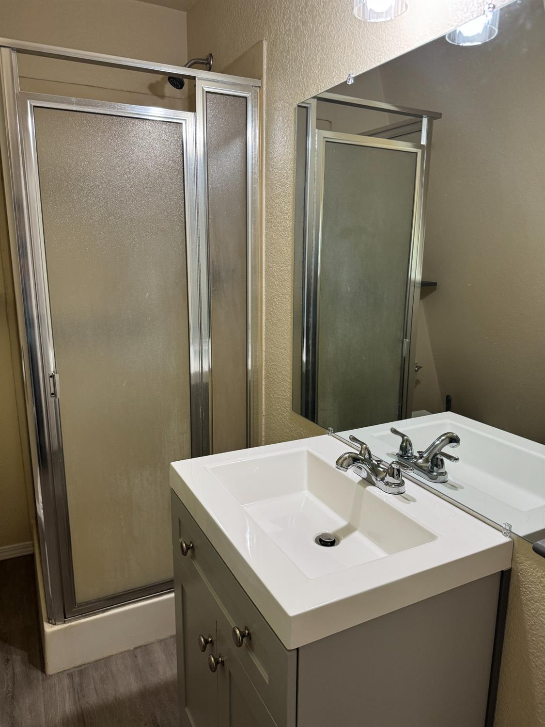 670 Stone House Road Auburn, CA 95603 - Photo 34 of 46 a bathroom with a sink and a mirror