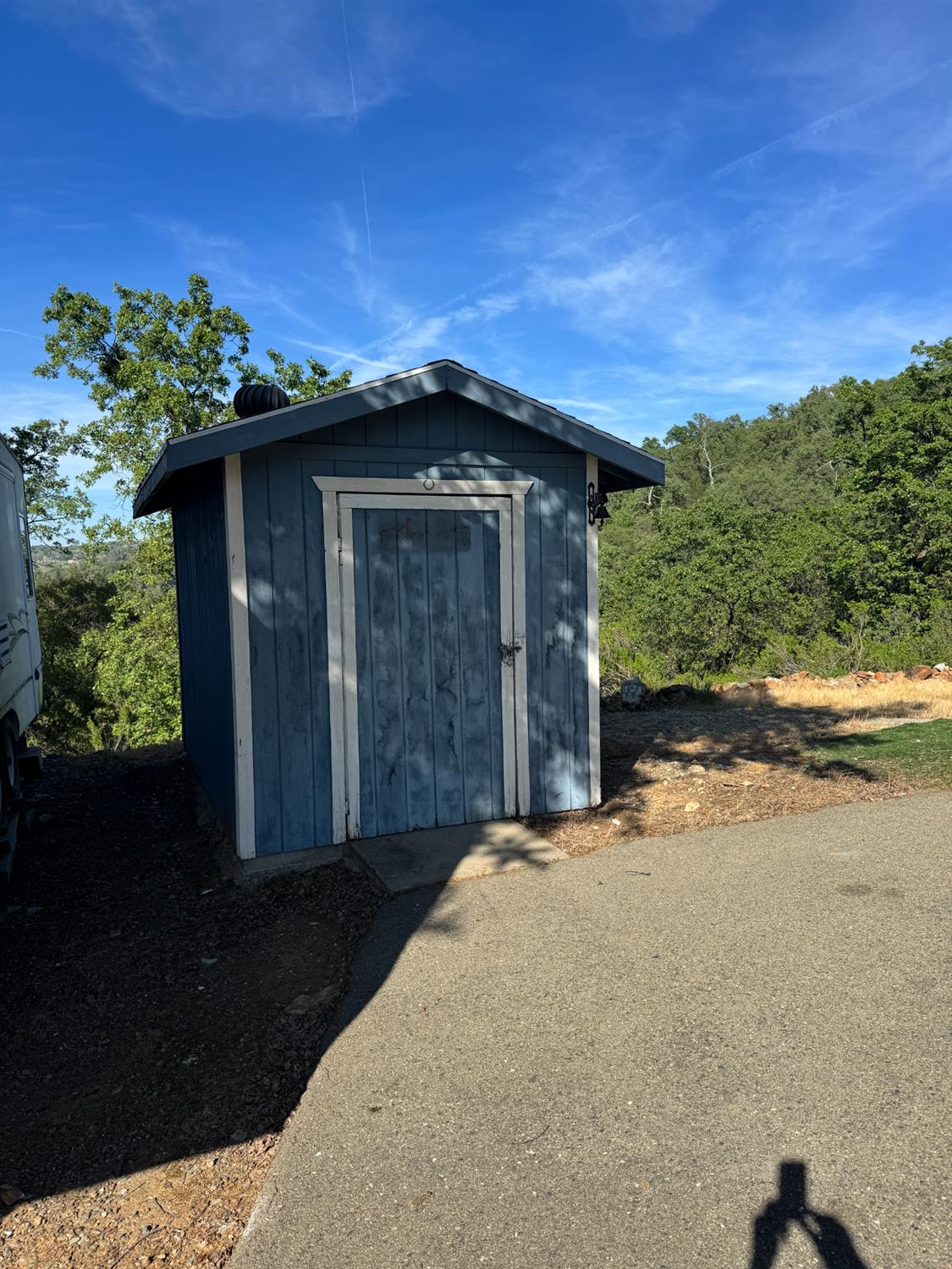 670 Stone House Road Auburn, CA 95603 - Photo 37 of 46 a view of a wooden house with a yard