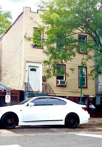 a view of a white house with a sink and dishwasher