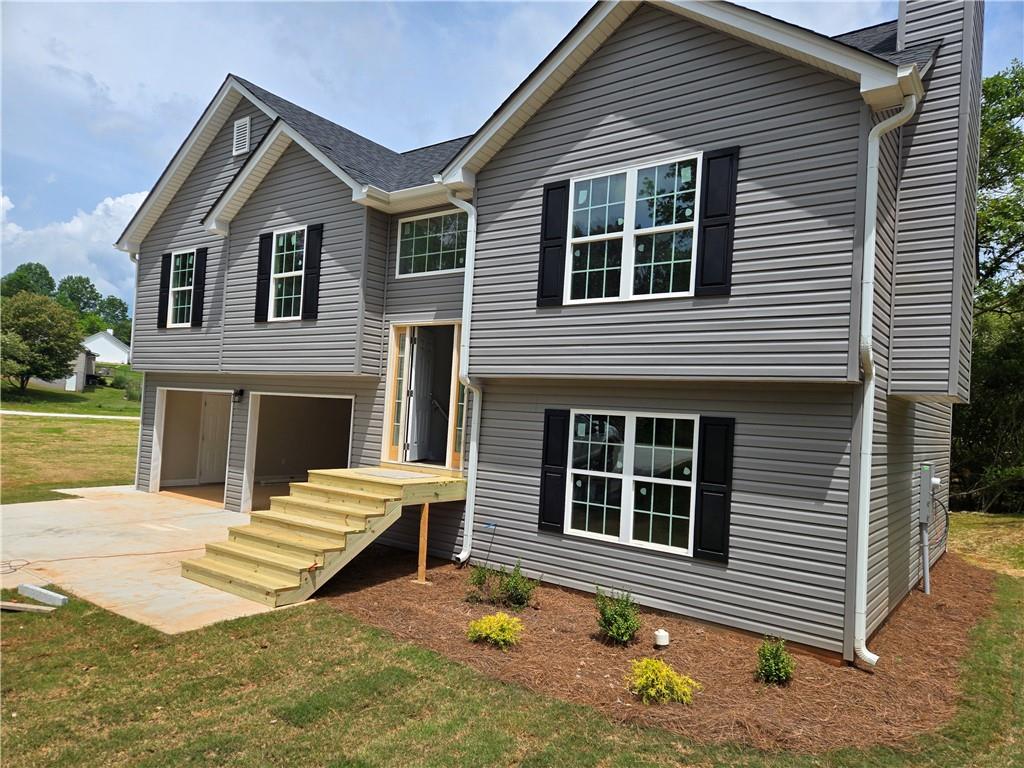 123 Quail Vw Ridge Cleveland, GA 30528 - Photo 1 of 1 a view of house with wooden deck and a yard