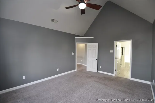 a bathroom with a granite countertop sink a large mirror and a bathtub
