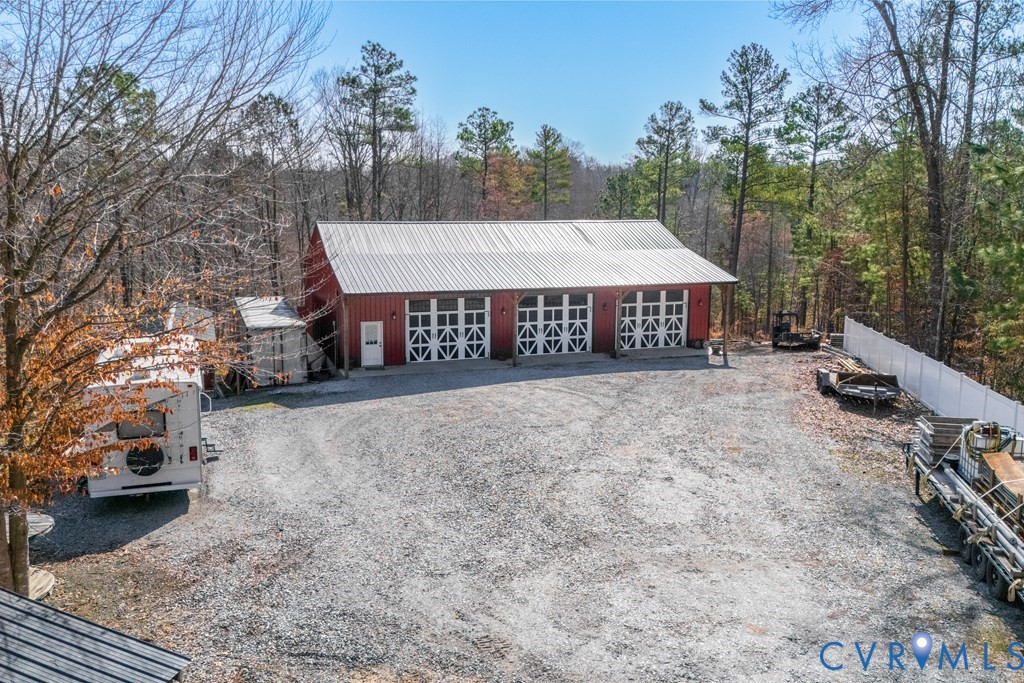 7601 Amelia Springs Road Jetersville, VA 23083 - Photo 21 of 21 a view of a house with a yard and garage