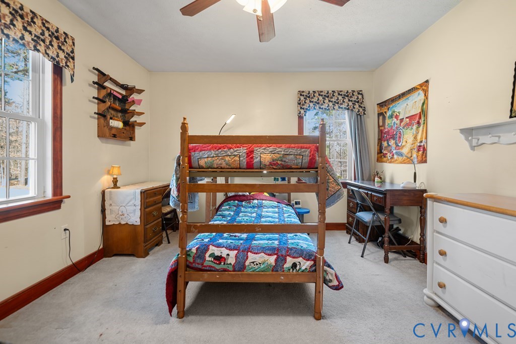 7601 Amelia Springs Road Jetersville, VA 23083 - Photo 6 of 21 a bedroom with furniture and a window