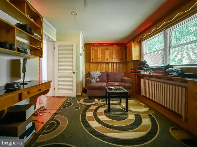 a room with furniture and a flat screen tv