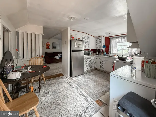 a kitchen with furniture and a stove