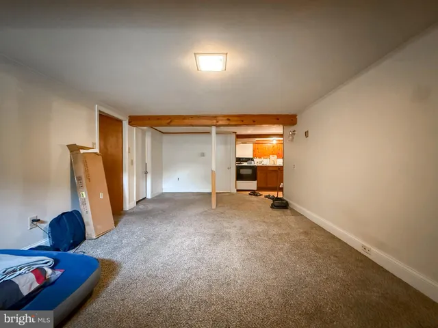 a view of room with workspace and windows