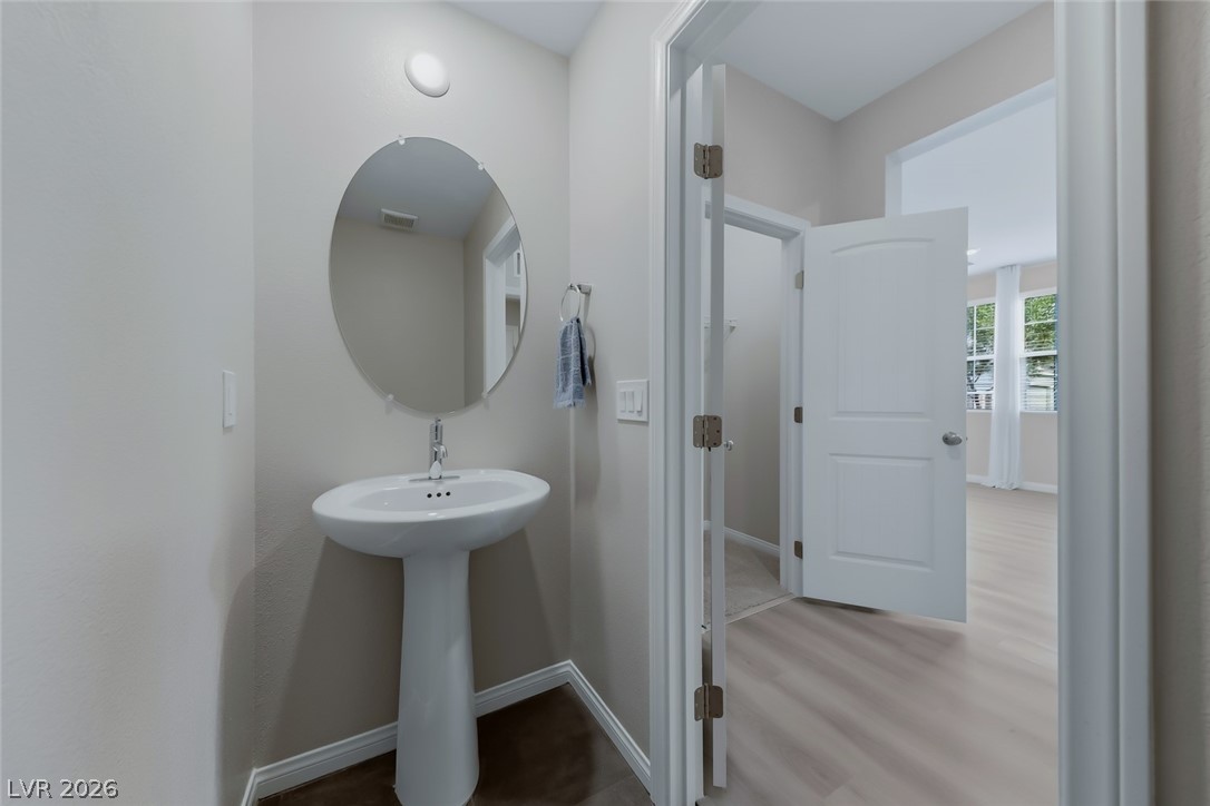 3564 Credere Lane Henderson, NV 89074 - Photo 33 of 40 Bathroom featuring baseboards and light wood-style flooring