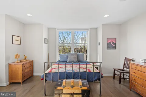a bed room with furniture and a window