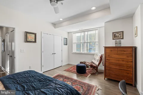 a bedroom with furniture and a window