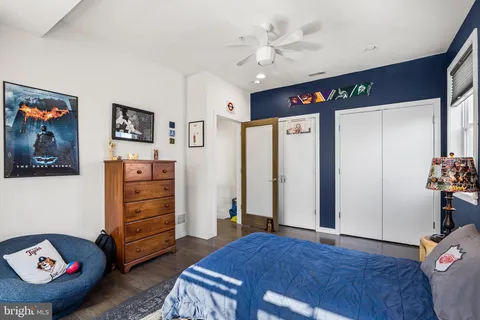 a bedroom with furniture and a window