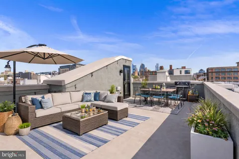 a view of a terrace with furniture