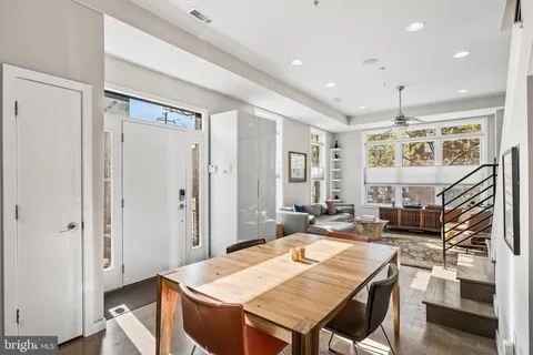 a view of a dining room with furniture window and wooden floor