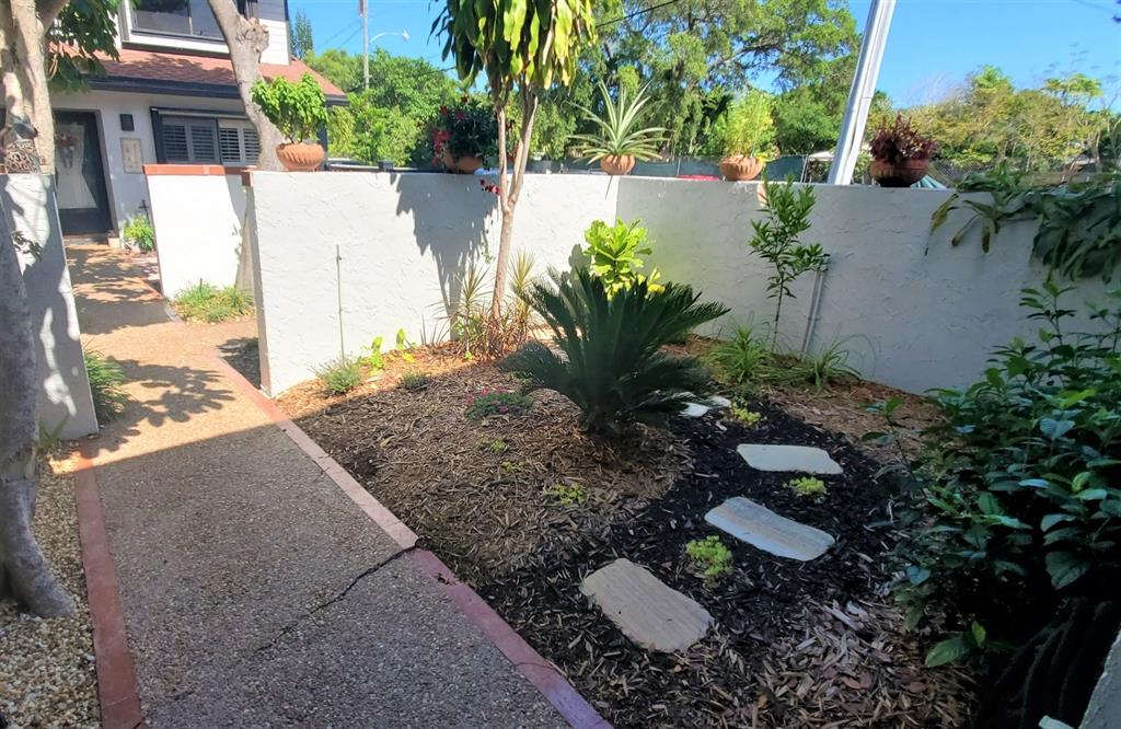 817 Southeast 12th Court, Unit 1 Fort Lauderdale, FL 33316 - Photo 17 of 25 a view of a backyard with plants and chairs