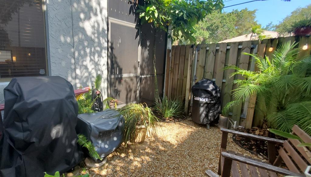 817 Southeast 12th Court, Unit 1 Fort Lauderdale, FL 33316 - Photo 18 of 25 a backyard of a house with lots of green space
