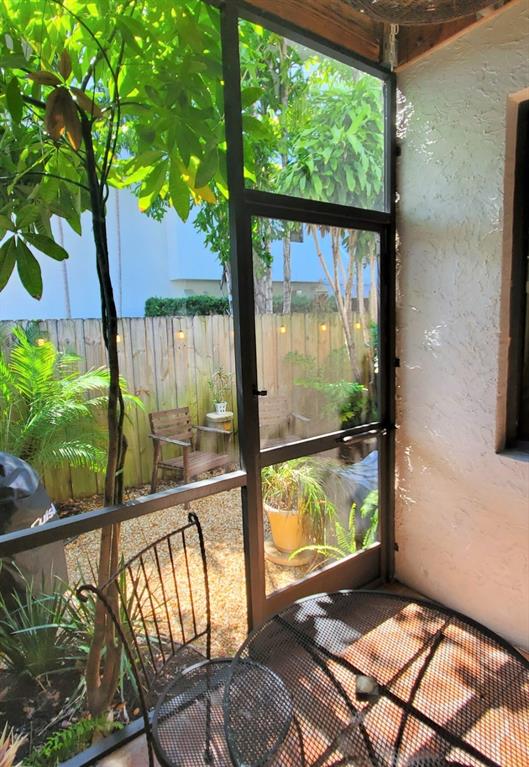 817 Southeast 12th Court, Unit 1 Fort Lauderdale, FL 33316 - Photo 19 of 25 a view of a balcony with floor to ceiling windows with wooden floor