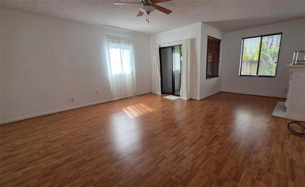 817 Southeast 12th Court, Unit 1 Fort Lauderdale, FL 33316 - Photo 2 of 25 wooden floor in an empty room with a window