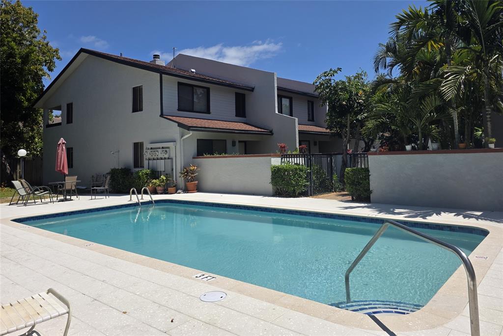 817 Southeast 12th Court, Unit 1 Fort Lauderdale, FL 33316 - Photo 22 of 25 a view of a house with pool plants and large trees