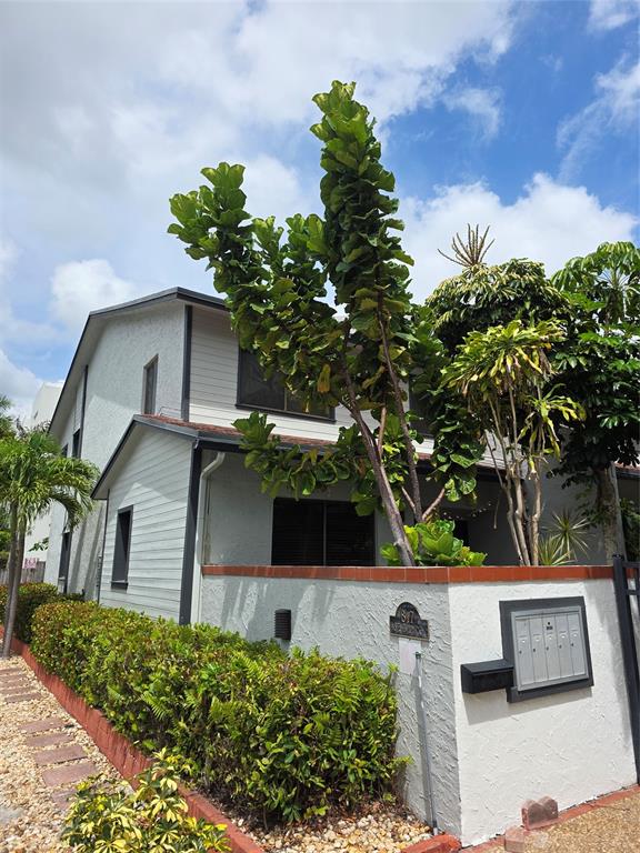 817 Southeast 12th Court, Unit 1 Fort Lauderdale, FL 33316 - Photo 23 of 25 a front view of a house with a yard