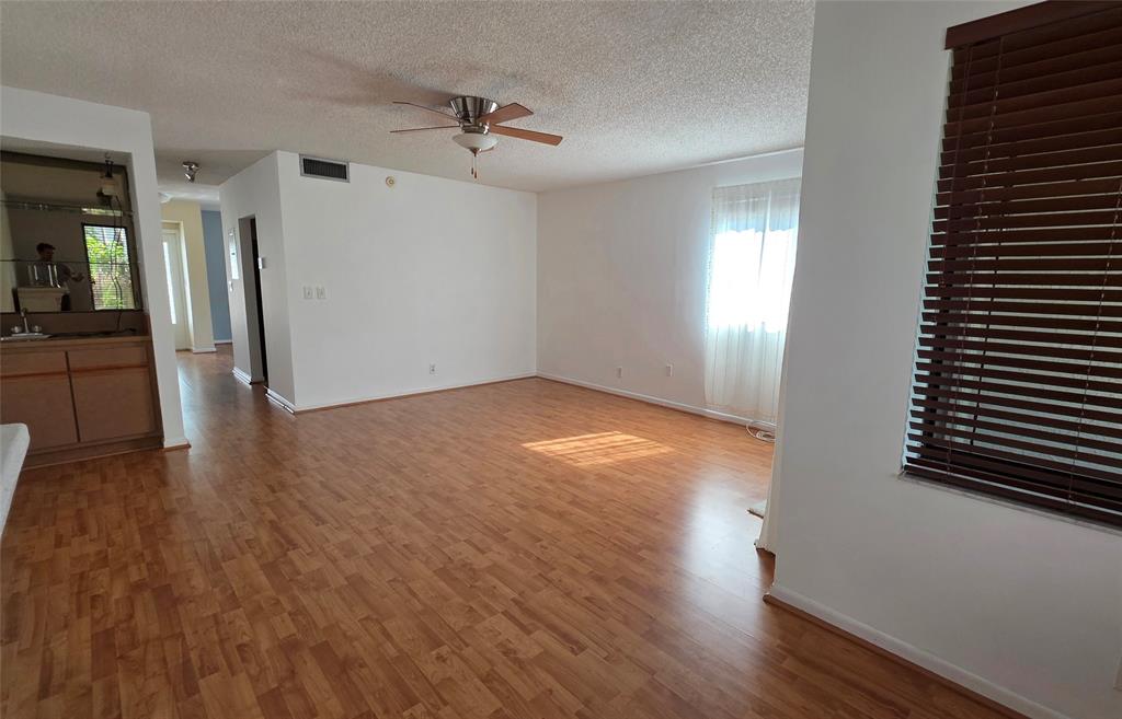 817 Southeast 12th Court, Unit 1 Fort Lauderdale, FL 33316 - Photo 3 of 25 wooden floor in an empty room with a window