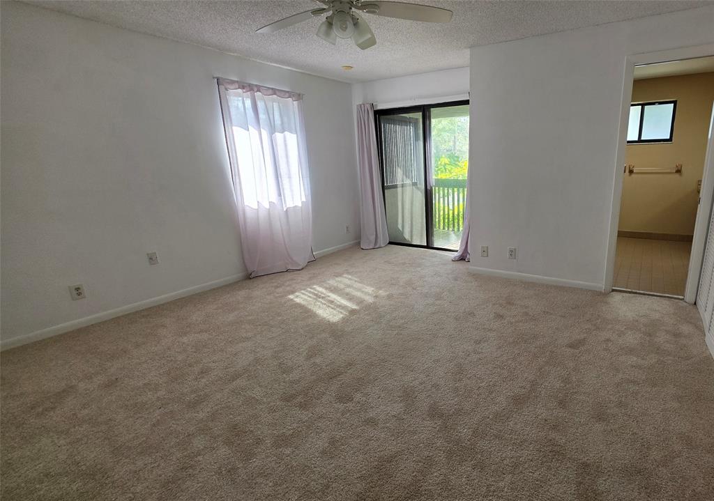 817 Southeast 12th Court, Unit 1 Fort Lauderdale, FL 33316 - Photo 4 of 25 an empty room with windows and closet