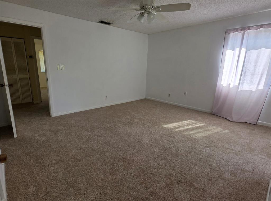 817 Southeast 12th Court, Unit 1 Fort Lauderdale, FL 33316 - Photo 5 of 25 an empty room with a empty space and windows