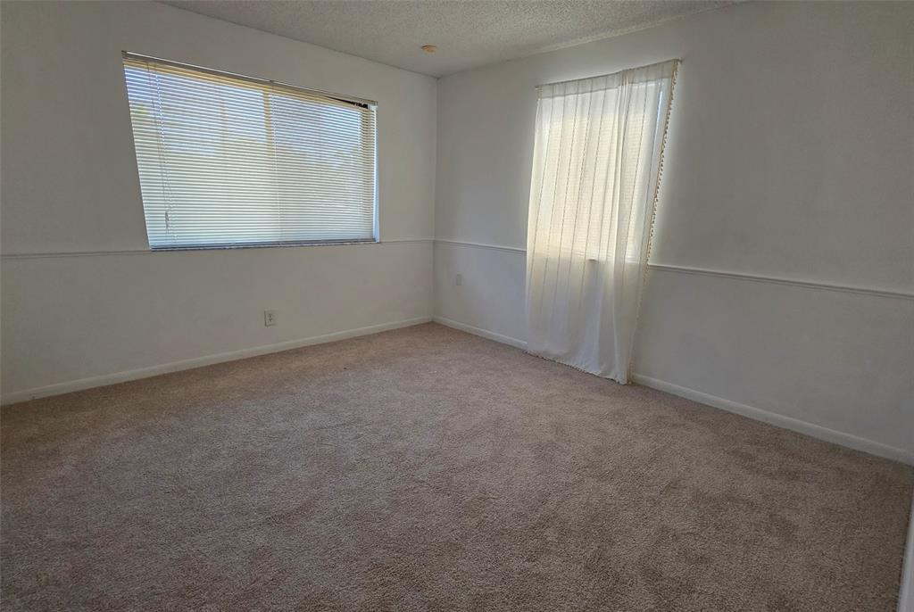 817 Southeast 12th Court, Unit 1 Fort Lauderdale, FL 33316 - Photo 6 of 25 an empty room with a window