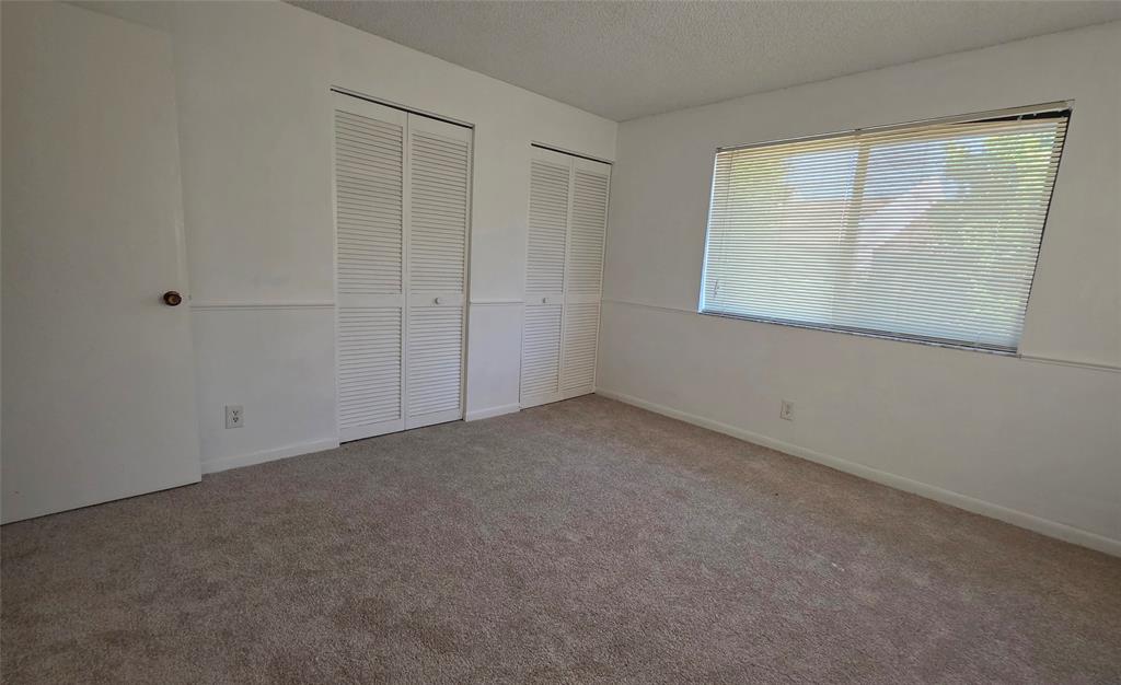817 Southeast 12th Court, Unit 1 Fort Lauderdale, FL 33316 - Photo 7 of 25 an empty room with windows
