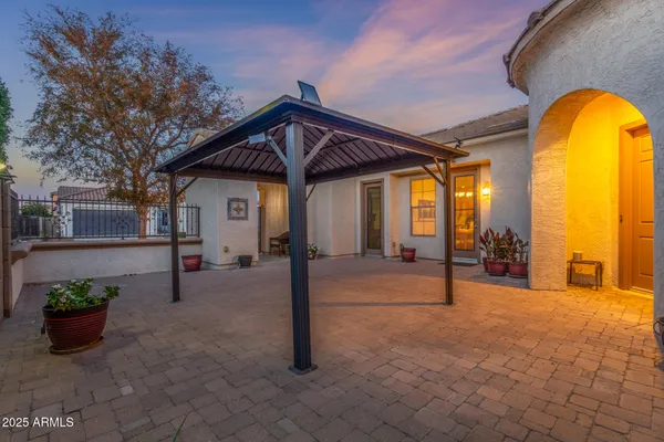 a view of a house with a backyard