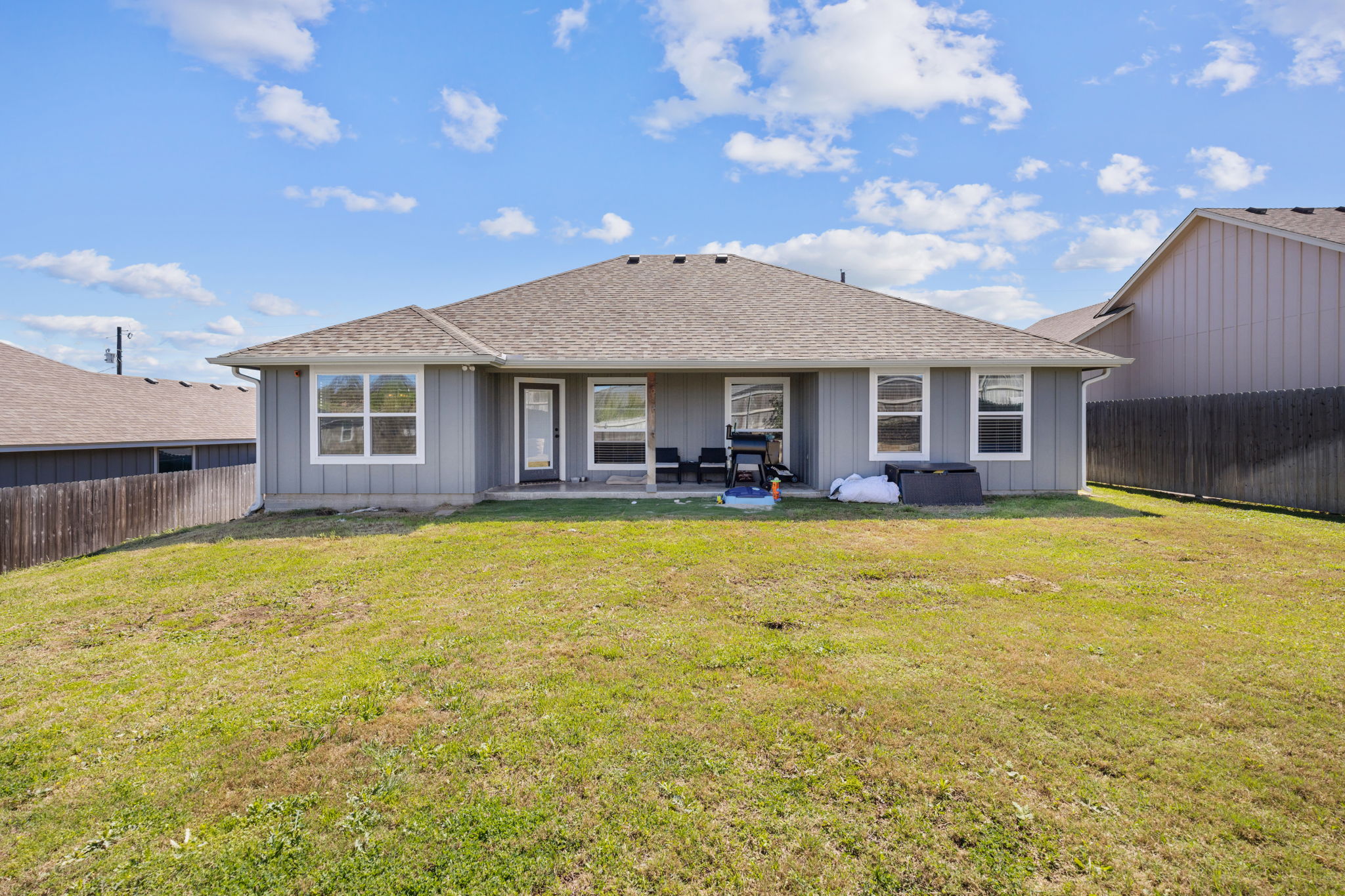 1313 Sandstone Cove Lampasas, TX 76550 - Photo 24 of 25 a swimming pool with outdoor seating and yard