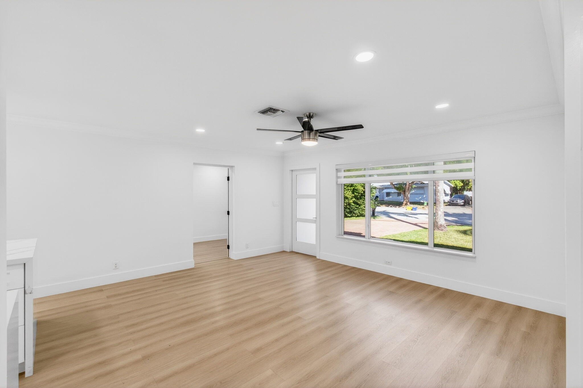 360 Southwest 2nd Street Boca Raton, FL 33432 - Photo 13 of 100 an empty room with wooden floor and windows
