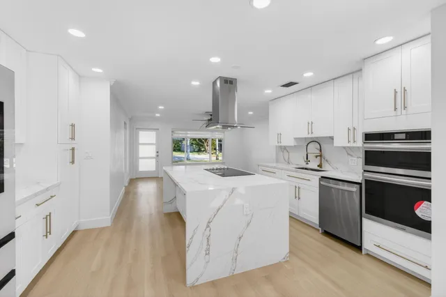 a bathroom with a sink mirror vanity and toilet