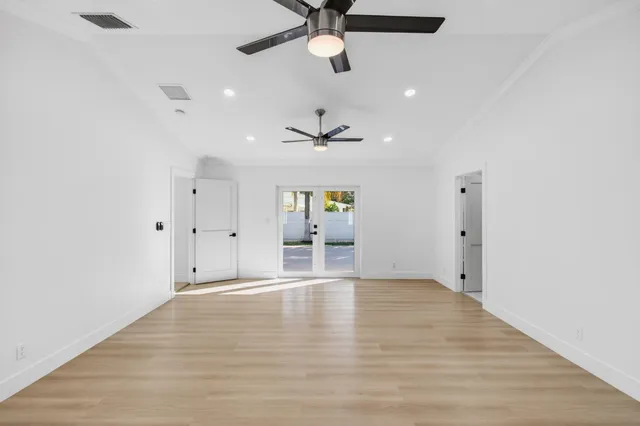 an aerial view of residential houses with outdoor space and street view
