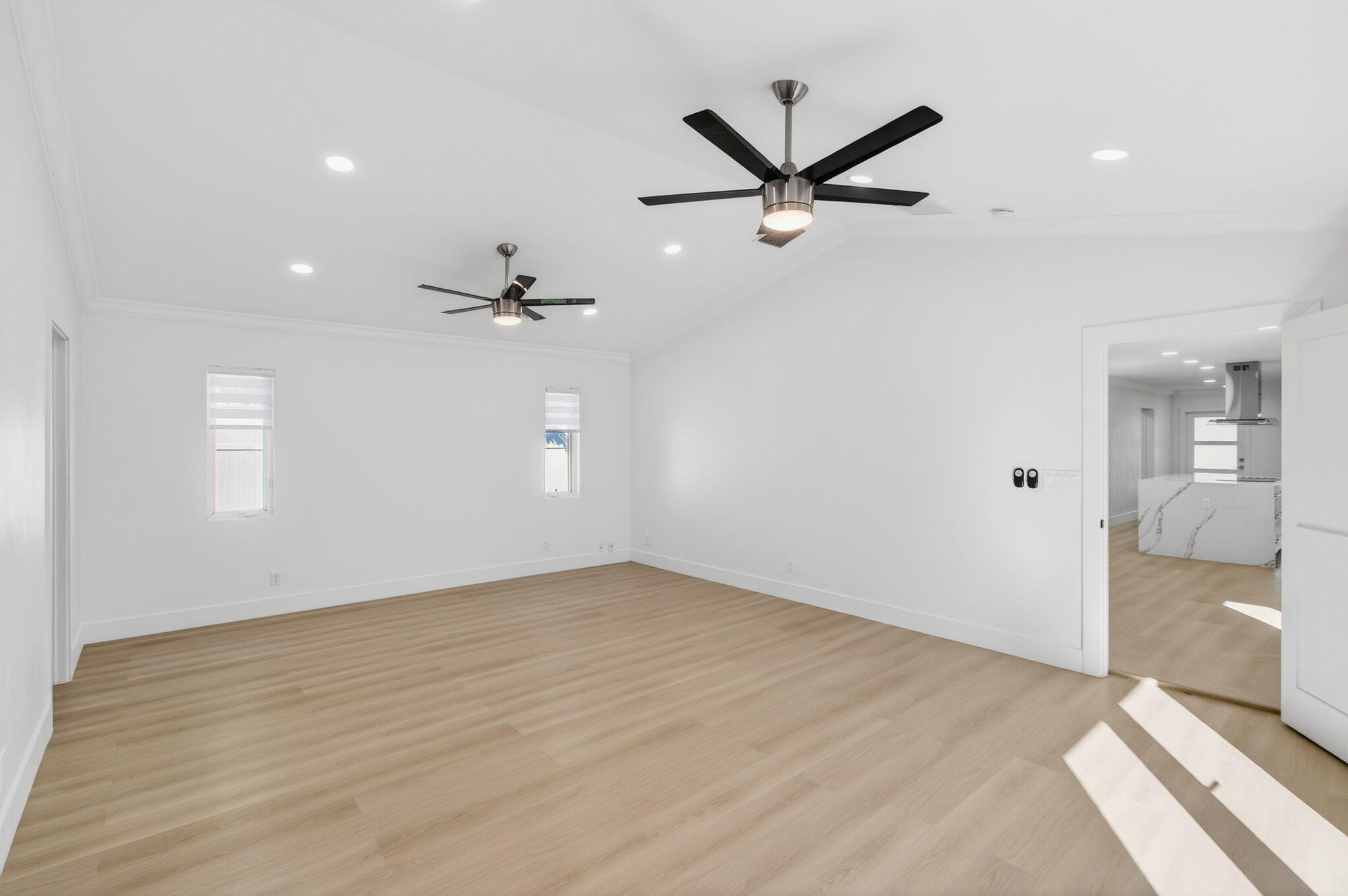 360 Southwest 2nd Street Boca Raton, FL 33432 - Photo 34 of 100 a view of a livingroom with a ceiling fan and wooden floor