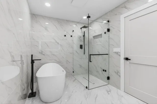 an aerial view of residential houses with outdoor space and street view