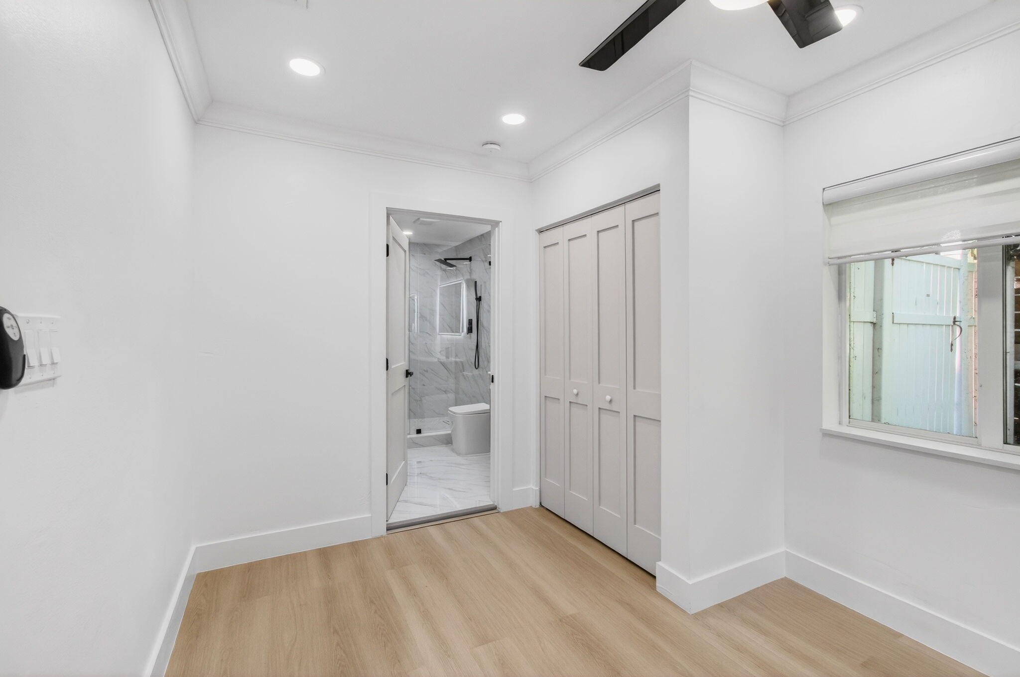 360 Southwest 2nd Street Boca Raton, FL 33432 - Photo 45 of 100 an empty room with wooden floor and windows