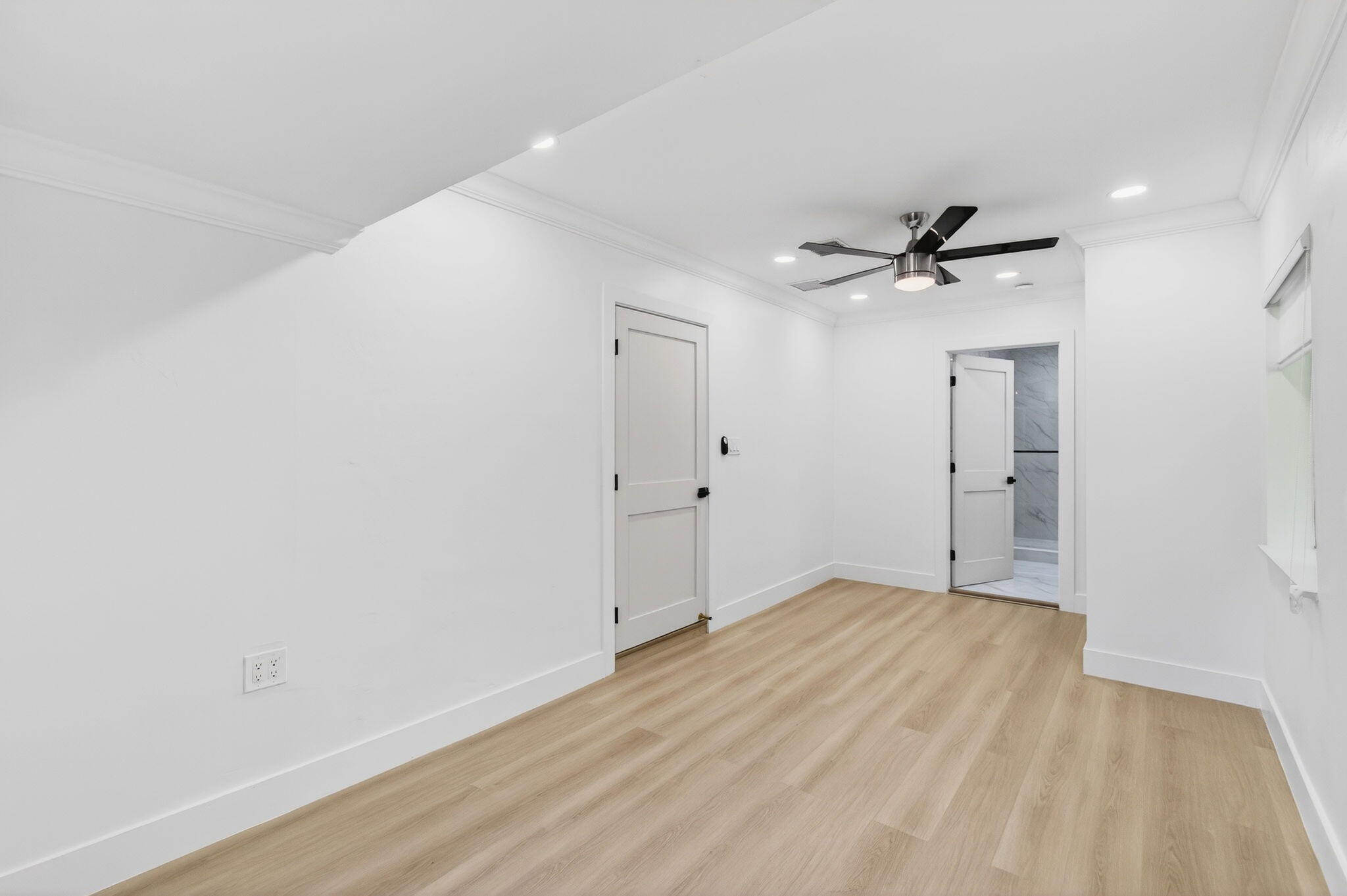 360 Southwest 2nd Street Boca Raton, FL 33432 - Photo 46 of 100 a view of empty room with wooden floor and ceiling fan