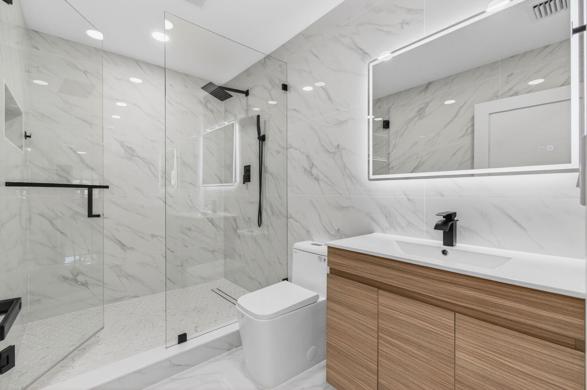 360 Southwest 2nd Street Boca Raton, FL 33432 - Photo 47 of 100 a bathroom with a sink a toilet and shower