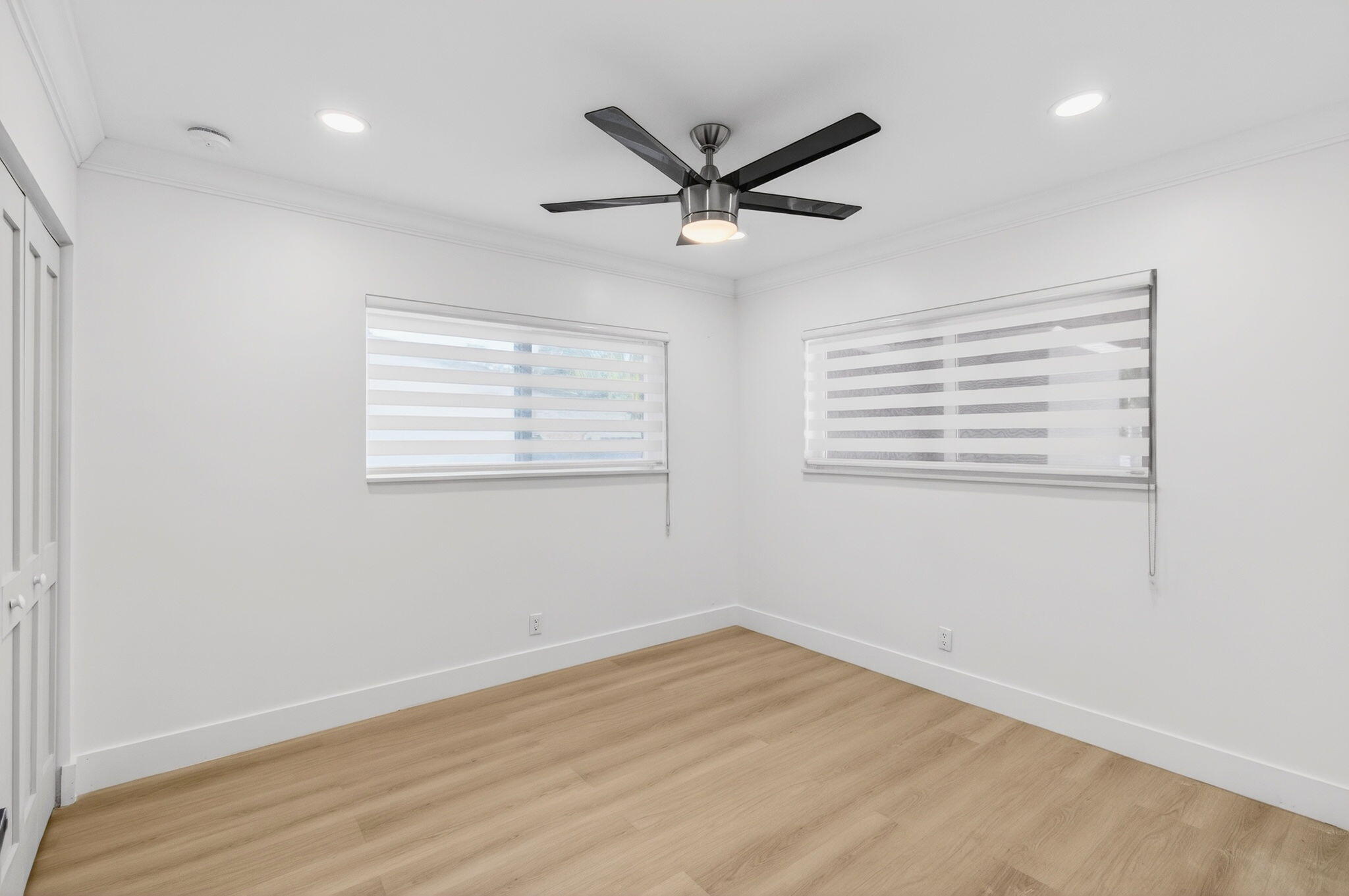 360 Southwest 2nd Street Boca Raton, FL 33432 - Photo 54 of 100 a view of a room with wooden floor and windows