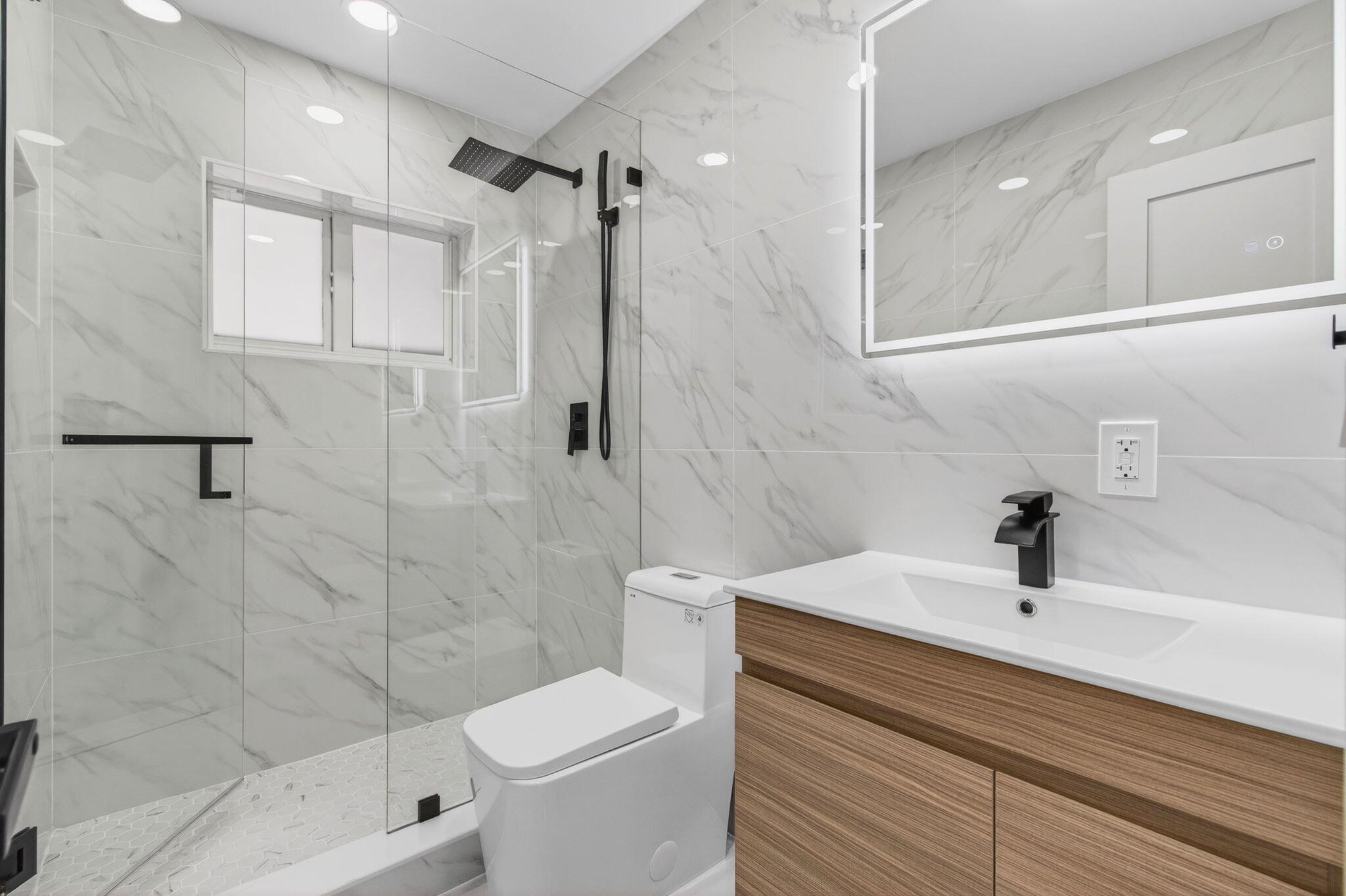 360 Southwest 2nd Street Boca Raton, FL 33432 - Photo 58 of 100 a bathroom with a sink a toilet and shower