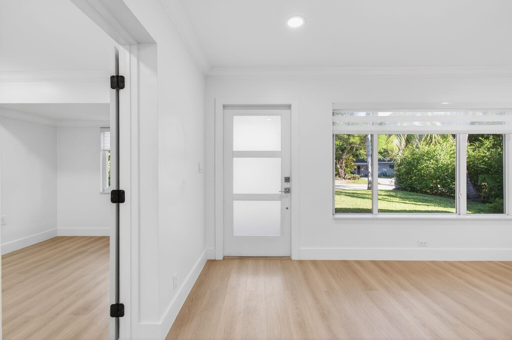 360 Southwest 2nd Street Boca Raton, FL 33432 - Photo 8 of 100 a view of a room with wooden floor and window