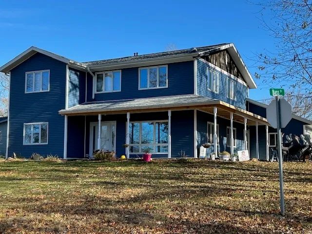 a front view of a residential apartment building with a yard