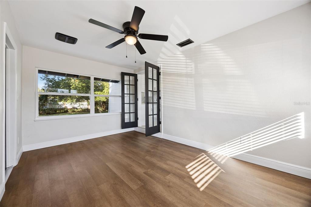 1001 Alton Avenue Orlando, FL 32804 - Photo 13 of 20 a view of empty room with wooden floor and fan