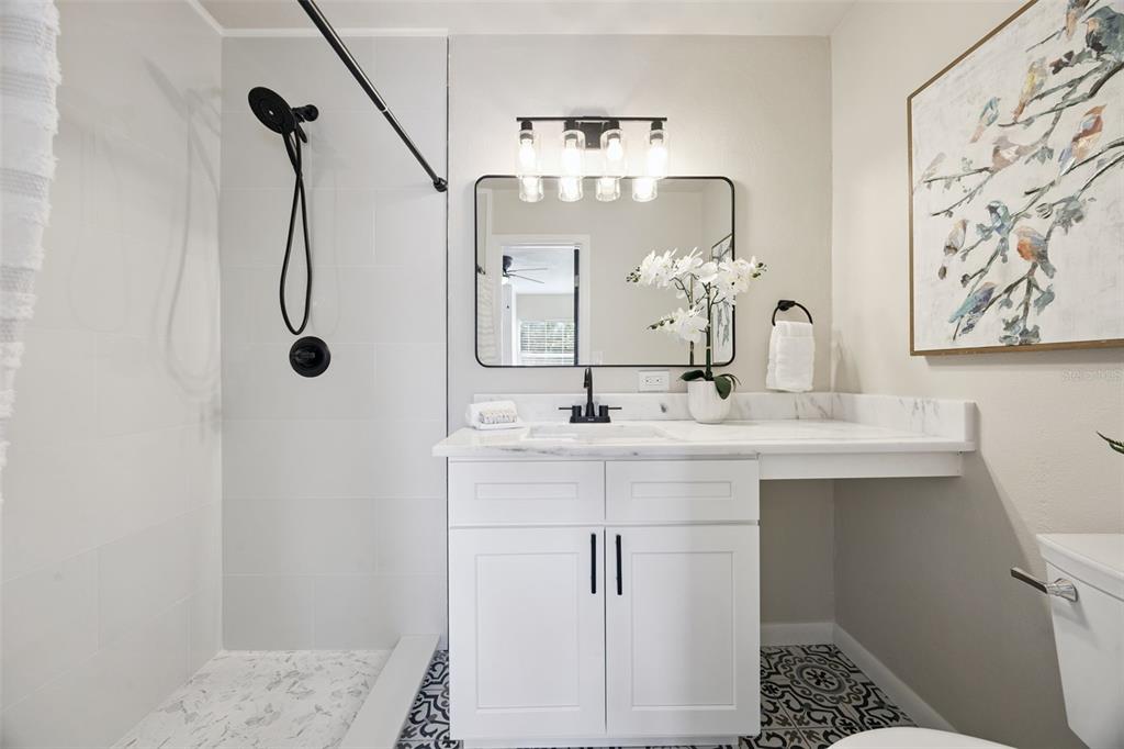 1001 Alton Avenue Orlando, FL 32804 - Photo 16 of 20 a bathroom with a sink vanity and mirror