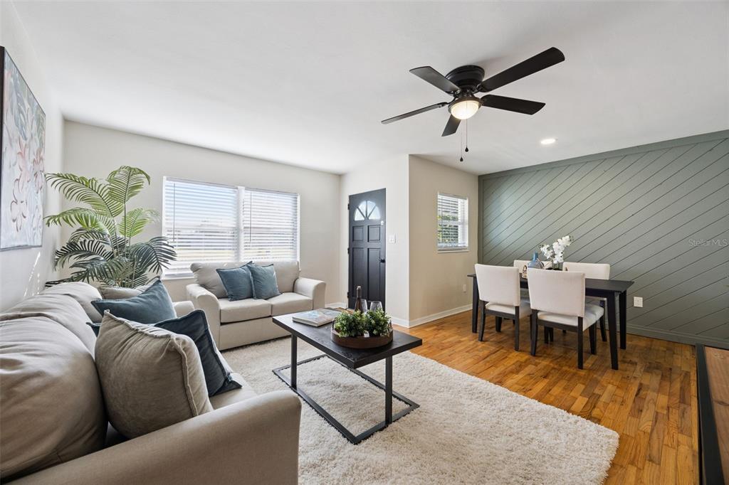 1001 Alton Avenue Orlando, FL 32804 - Photo 3 of 20 a living room with furniture wooden floor and a potted plant
