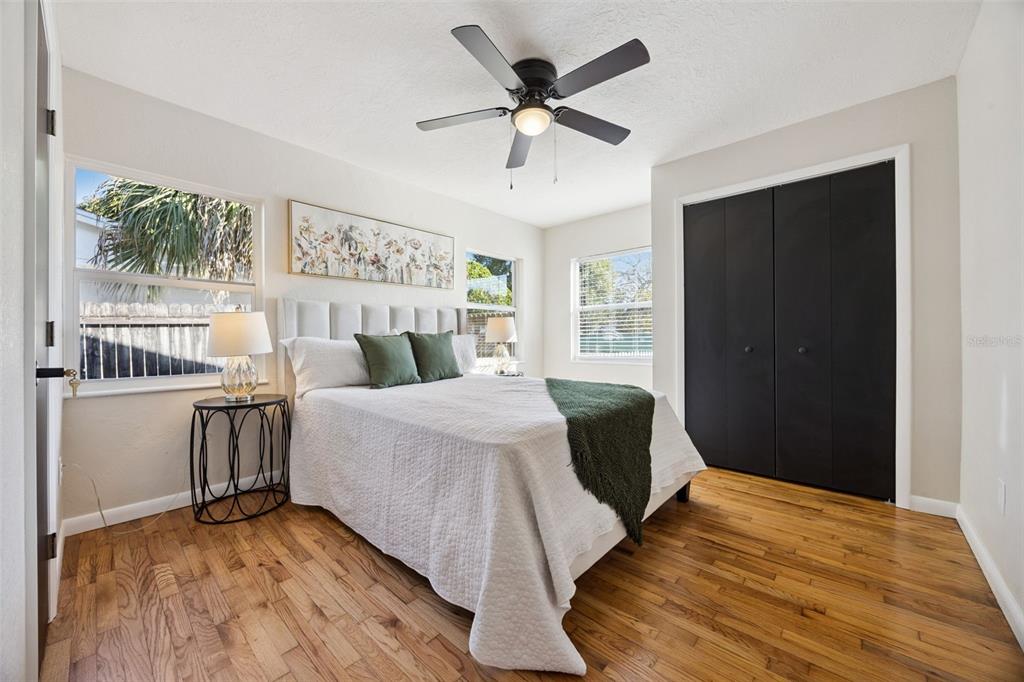 1001 Alton Avenue Orlando, FL 32804 - Photo 8 of 20 a bedroom with a bed and wooden floor