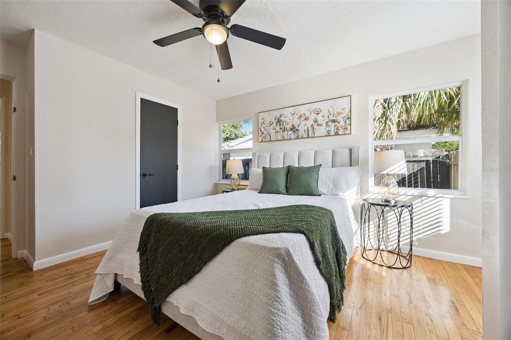 1001 Alton Avenue Orlando, FL 32804 - Photo 9 of 20 a spacious bedroom with a bed and wooden floor